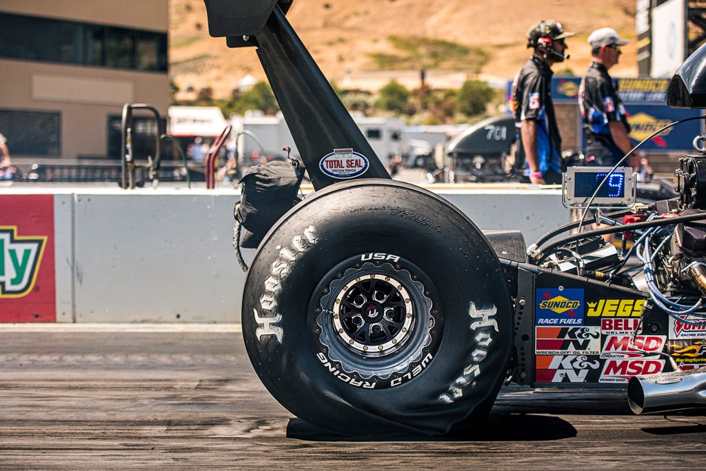 Hoosier drag tires on dragster on drag strip